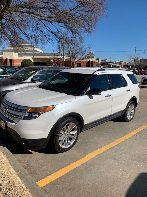 White Ford Explorer parked in a lot